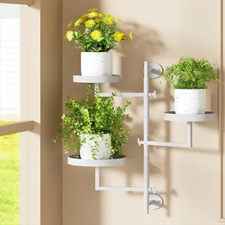 adjustable white wall-mounted plant rotating stand with four potted plants (yellow flowers, leafy greens, and small shrubs) near a sunlit window