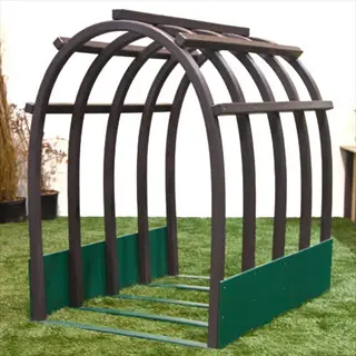 cattle panel arch garden trellis with curved brown beams and green base panels on artificial turf, designed for climbing plants in a garden setting