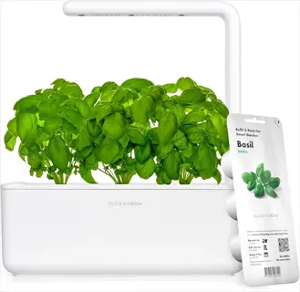 click and grow smart garden countertop system with growing basil plants and basil seed pod packaging