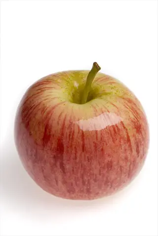 close-up of a fresh gala apple fruit with red-yellow skin on white background