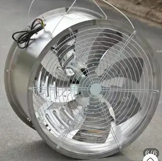 greenhouse horizontal fan (industrial air circulation system) with protective grille, metallic blades, and hanging hardware on concrete surface