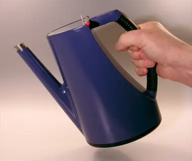 hand holding a blue long spout watering can against a plain light background
