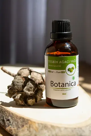 organic neem oil bottle (50ml) with botanical elements on wooden slab, featuring turkish and english labels