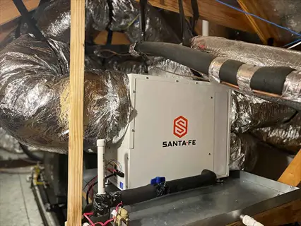 santa fe brand greenhouse dehumidifier unit with ductwork in mechanical space, designed for humidity control in greenhouse environments