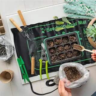 seedling heat mat with instructional text and illustrations, surrounded by gardening tools, seed trays, soil bags, and hands preparing for seed starting