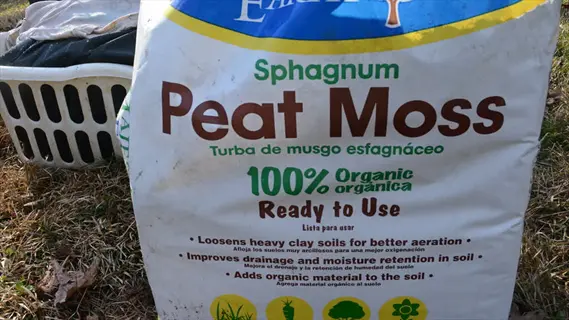 sphagnum peat moss bag with visible product labeling for gardening use - peat moss bag