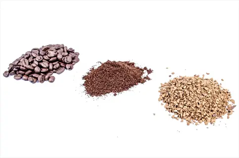 whole coffee beans, dark brown coffee grounds pile, and light brown instant coffee granules arranged in a row on white background